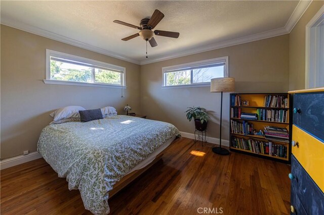 3158 Erie Ave, Merced, CA 95340 - bedroom with baseboards, wood finished floors, crown molding, and a ceiling fan