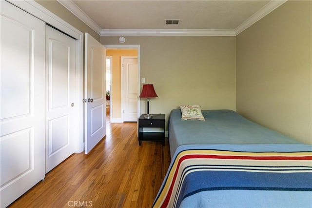 3158 Erie Ave, Merced, CA 95340 - bedroom with wood finished floors and ornamental molding