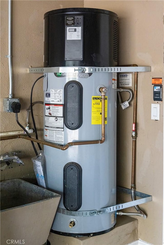 3158 Erie Ave, Merced, CA 95340 - utility room with hybrid water heater and a sink