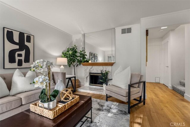 922 N Redding Way Unit E, Upland, CA 91786 - living area featuring a glass covered fireplace and wood finished floors