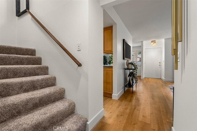 922 N Redding Way Unit E, Upland, CA 91786 - stairway featuring wood-type flooring and baseboards