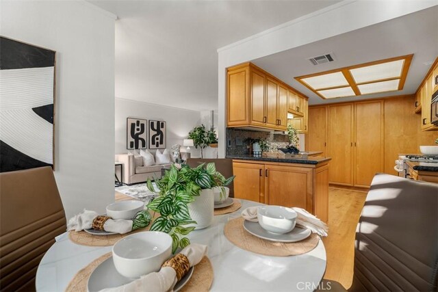 922 N Redding Way Unit E, Upland, CA 91786 - dining area with light wood-style flooring