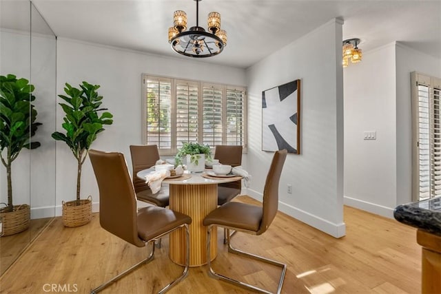 922 N Redding Way Unit E, Upland, CA 91786 - dining room featuring a chandelier, baseboards, and wood finished floors
