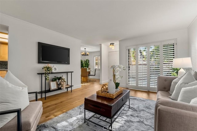 922 N Redding Way Unit E, Upland, CA 91786 - living room with wood finished floors, a chandelier, and baseboards