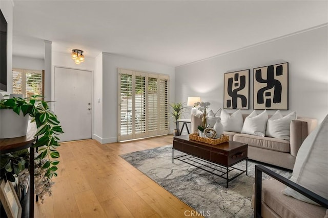 922 N Redding Way Unit E, Upland, CA 91786 - living room featuring hardwood / wood-style flooring and baseboards
