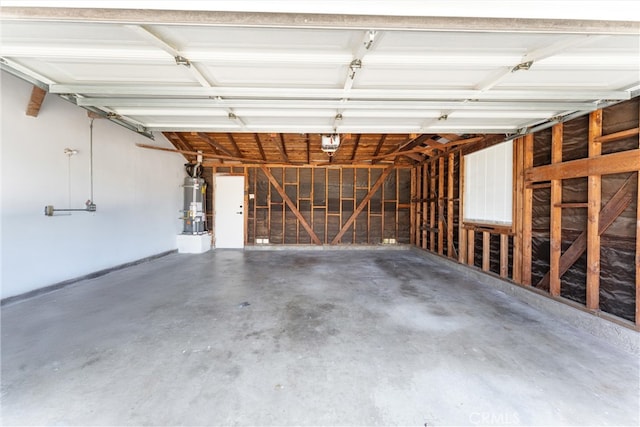 5332 Huntley Ave, Garden Grove, CA 92845 - garage featuring strapped water heater and a garage door opener