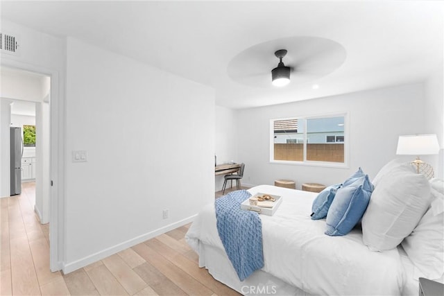 5332 Huntley Ave, Garden Grove, CA 92845 - bedroom with freestanding refrigerator, light wood finished floors, and ceiling fan