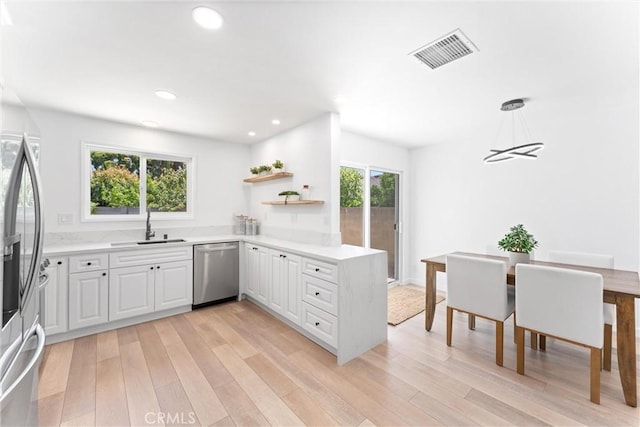 5332 Huntley Ave, Garden Grove, CA 92845 - kitchen featuring stainless steel appliances, open shelves, light wood-style floors, recessed lighting, and white cabinetry