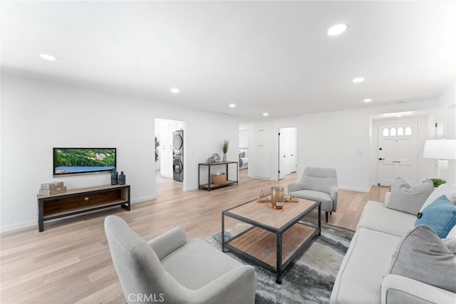 5332 Huntley Ave, Garden Grove, CA 92845 - living area with stacked washer and clothes dryer, recessed lighting, and light wood-style flooring