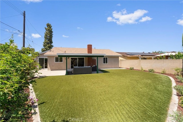 5332 Huntley Ave, Garden Grove, CA 92845 - back of property with a patio area, a chimney, stucco siding, and an outdoor hangout area