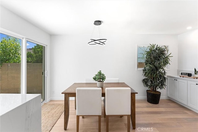 5332 Huntley Ave, Garden Grove, CA 92845 - dining space with light wood finished floors, recessed lighting, and a chandelier