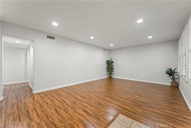 76 City Stroll, Irvine, CA 92620 - spare room with wood finished floors, recessed lighting, and baseboards