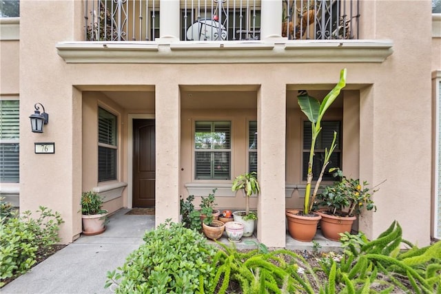 76 City Stroll, Irvine, CA 92620 - entrance to property featuring a balcony, a porch, and stucco siding