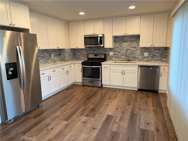 41134 Via Halcon, Temecula, CA 92591 - kitchen featuring stainless steel appliances, a sink, light countertops, dark wood finished floors, and recessed lighting
