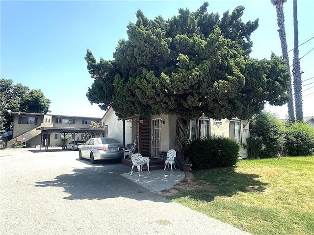 11215 Mulhall St, El Monte, CA 91731 - view of property hidden behind natural elements featuring stucco siding and a front yard