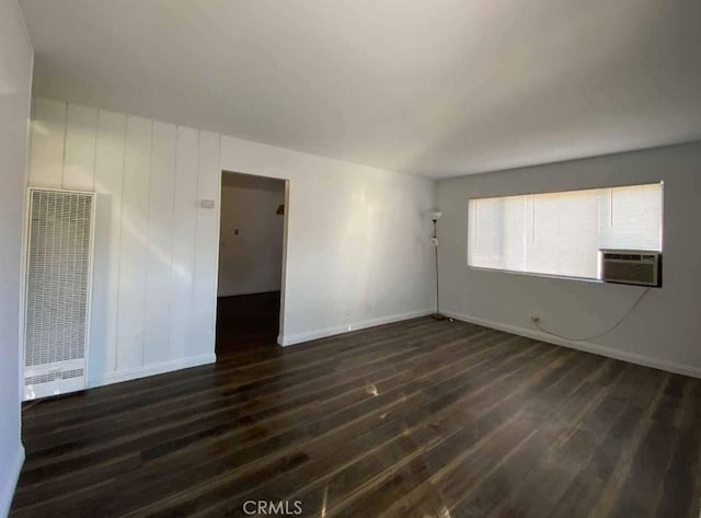 11215 Mulhall St, El Monte, CA 91731 - unfurnished room featuring a heating unit, dark wood-type flooring, baseboards, and cooling unit