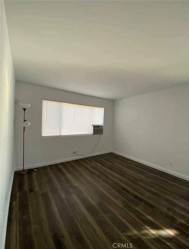 11215 Mulhall St, El Monte, CA 91731 - spare room featuring dark wood finished floors, baseboards, and cooling unit