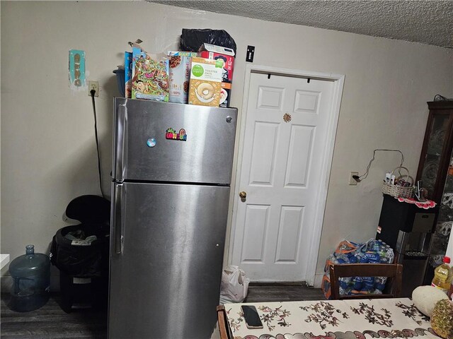 953 E 22nd St, Los Angeles, CA 90011 - kitchen with freestanding refrigerator and wood finished floors
