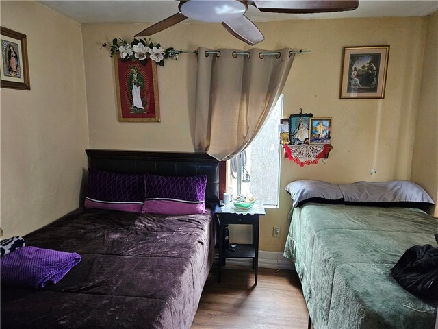 953 E 22nd St, Los Angeles, CA 90011 - bedroom featuring wood finished floors