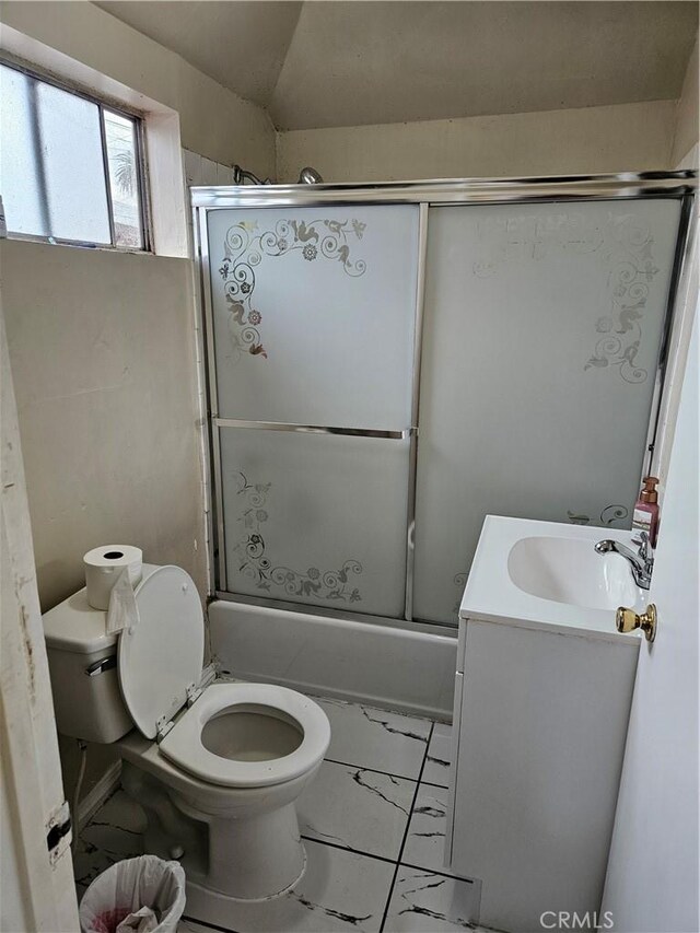 953 E 22nd St, Los Angeles, CA 90011 - bathroom with marble look tiles, toilet, vanity, and enclosed tub / shower combo