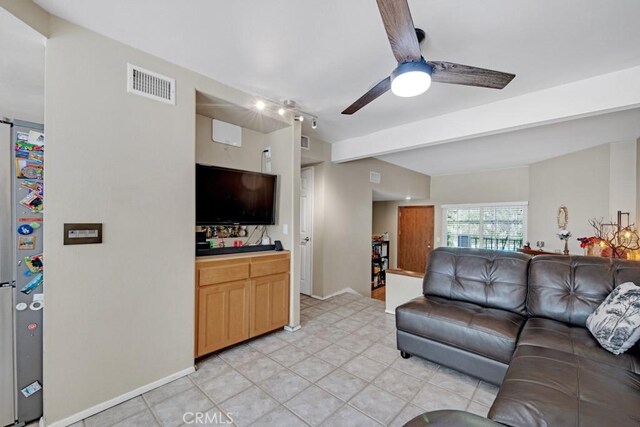7038 De Celis Pl Unit 9, Van Nuys, CA 91406 - living area with beam ceiling, ceiling fan, light tile patterned floors, and baseboards
