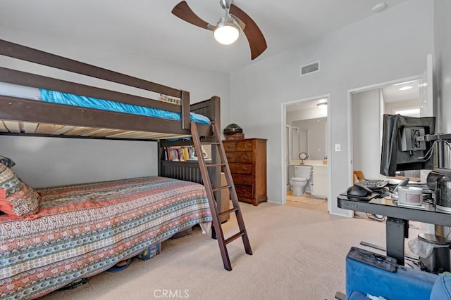 7038 De Celis Pl Unit 9, Van Nuys, CA 91406 - bedroom with light colored carpet, connected bathroom, and a ceiling fan