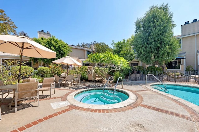 7038 De Celis Pl Unit 9, Van Nuys, CA 91406 - community pool featuring a hot tub, a patio, and outdoor dining area