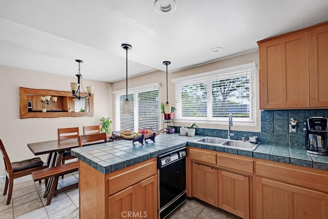 7038 De Celis Pl Unit 9, Van Nuys, CA 91406 - kitchen with a sink, black dishwasher, light tile patterned floors, and hanging light fixtures