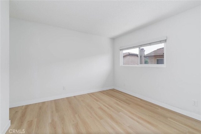 12105 Ramona Blvd, El Monte, CA 91732 - unfurnished room featuring wood finished floors and baseboards