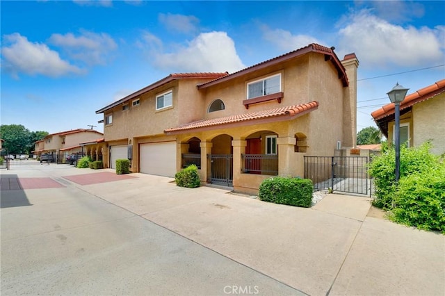 12105 Ramona Blvd, El Monte, CA 91732 - mediterranean / spanish home with stucco siding, a garage, driveway, and a gate