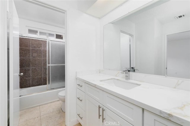 12105 Ramona Blvd, El Monte, CA 91732 - bathroom featuring toilet, vanity, and bath / shower combo with glass door