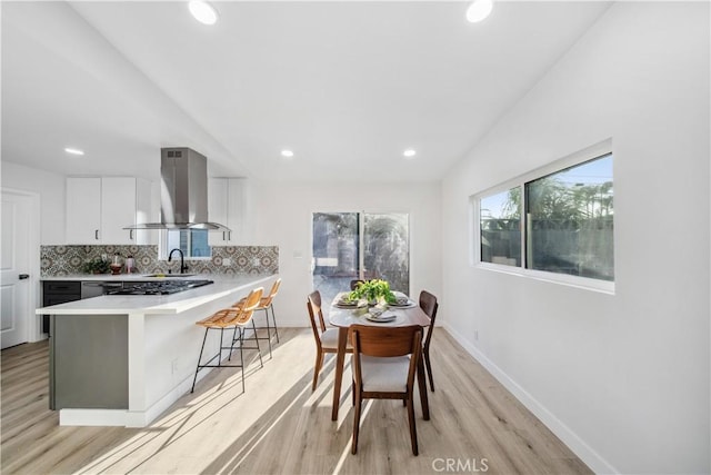957 N Jasmine Ave, Ontario, CA 91762 - dining room with light wood finished floors, recessed lighting, and baseboards