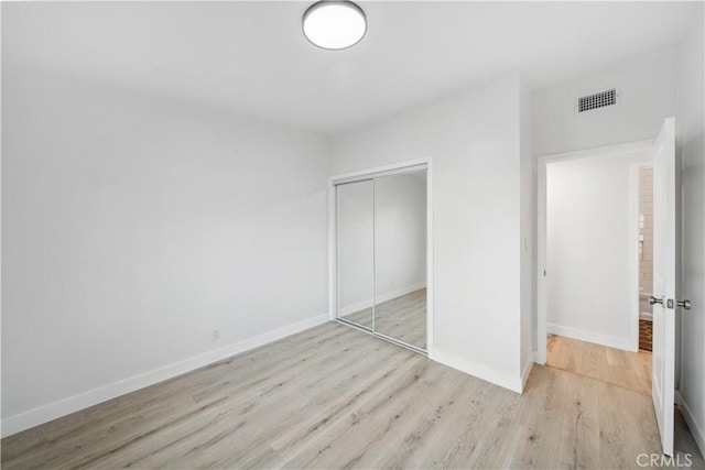 957 N Jasmine Ave, Ontario, CA 91762 - unfurnished bedroom featuring wood finished floors, a closet, and baseboards