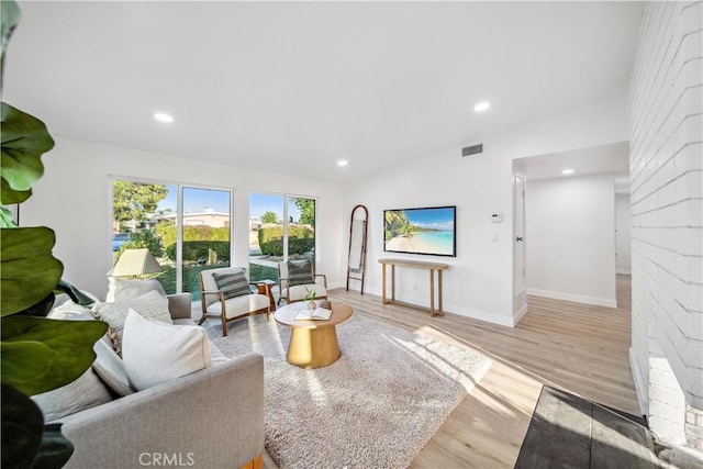 957 N Jasmine Ave, Ontario, CA 91762 - living room with wood finished floors, recessed lighting, and baseboards