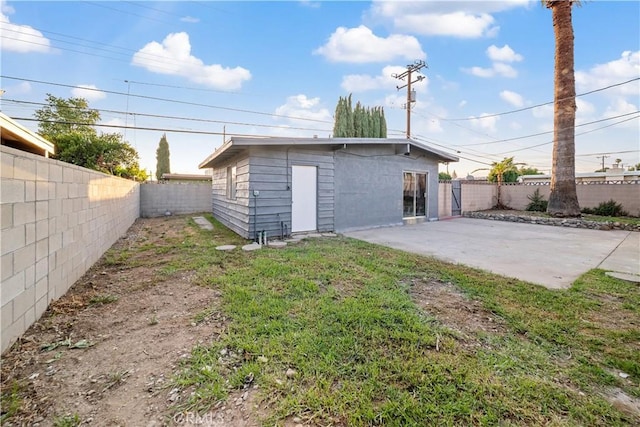 957 N Jasmine Ave, Ontario, CA 91762 - rear view of house with a fenced backyard and a patio area