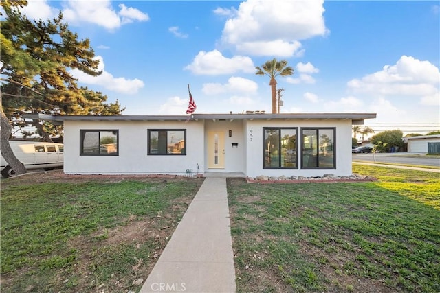 957 N Jasmine Ave, Ontario, CA 91762 - view of front of house featuring stucco siding and a front yard