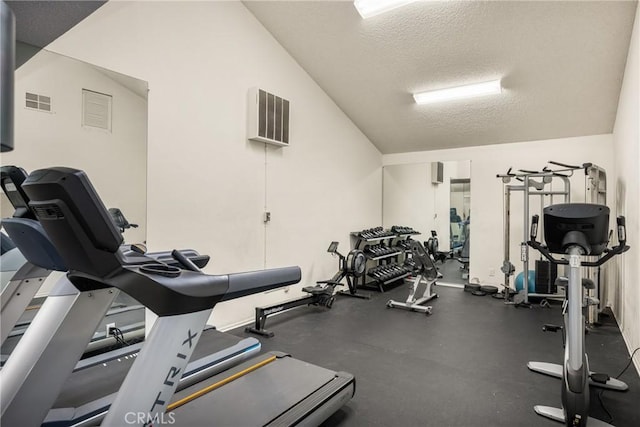 3026 Associated Unit 103, Fullerton, CA 92835 - exercise room featuring vaulted ceiling and a textured ceiling