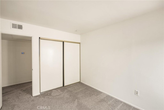 3026 Associated Unit 103, Fullerton, CA 92835 - unfurnished bedroom with light colored carpet, a closet, and baseboards