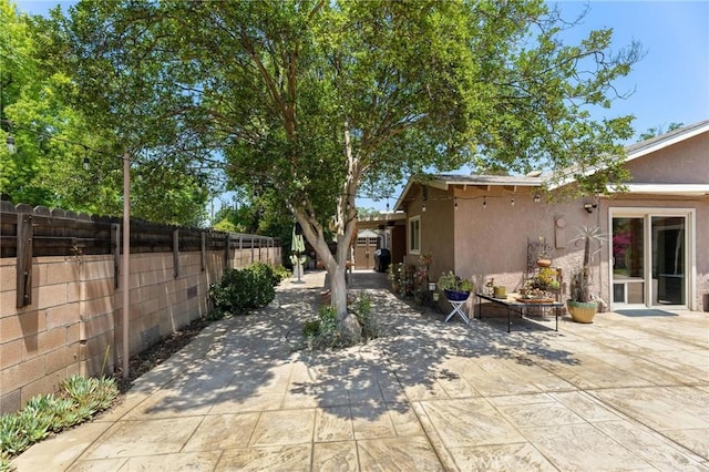 18770 Community St, Northridge, CA 91324 - fenced backyard featuring a patio area