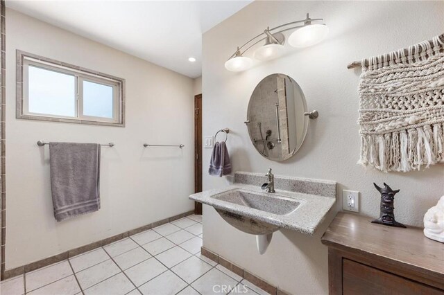 18770 Community St, Northridge, CA 91324 - bathroom featuring tile patterned flooring, a sink, recessed lighting, and baseboards