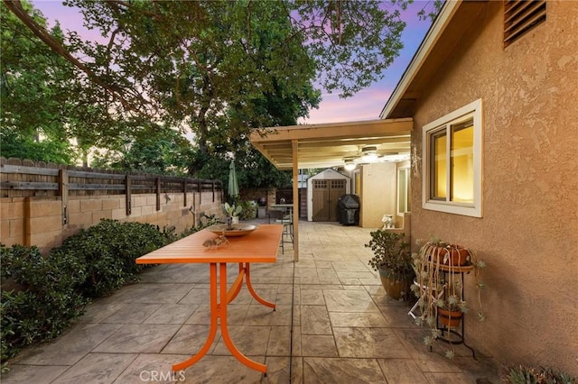 18770 Community St, Northridge, CA 91324 - patio terrace at dusk featuring a patio and a fenced backyard