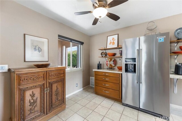 18770 Community St, Northridge, CA 91324 - kitchen with stainless steel refrigerator with ice dispenser, open shelves, brown cabinets, baseboards, and light countertops