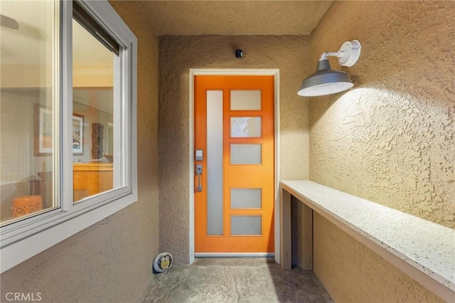 18770 Community St, Northridge, CA 91324 - doorway to property featuring stucco siding