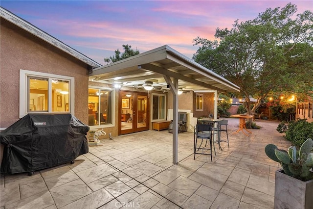 18770 Community St, Northridge, CA 91324 - patio terrace at dusk featuring a patio area, a grill, and outdoor dining space
