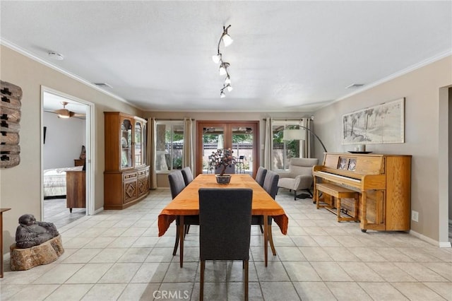 18770 Community St, Northridge, CA 91324 - dining room with light tile patterned floors, ornamental molding, rail lighting, french doors, and baseboards