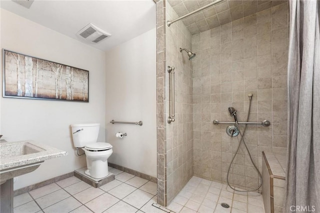 18770 Community St, Northridge, CA 91324 - full bathroom featuring toilet, a tile shower, tile patterned floors, and baseboards