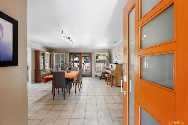 18770 Community St, Northridge, CA 91324 - dining space with french doors, light tile patterned flooring, rail lighting, and crown molding