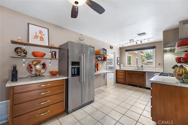 18770 Community St, Northridge, CA 91324 - kitchen featuring stainless steel appliances, open shelves, a sink, a ceiling fan, and brown cabinetry