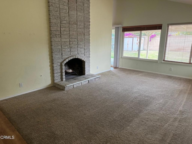 1721 Joliet Pl, Oxnard, CA 93030 - unfurnished living room with carpet, baseboards, a brick fireplace, and lofted ceiling
