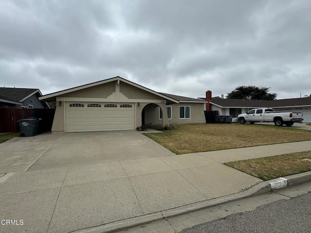 1721 Joliet Pl, Oxnard, CA 93030 - ranch-style house featuring a garage, driveway, and stucco siding